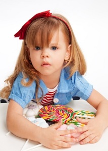Greedy Girl With Pile Of Sweets